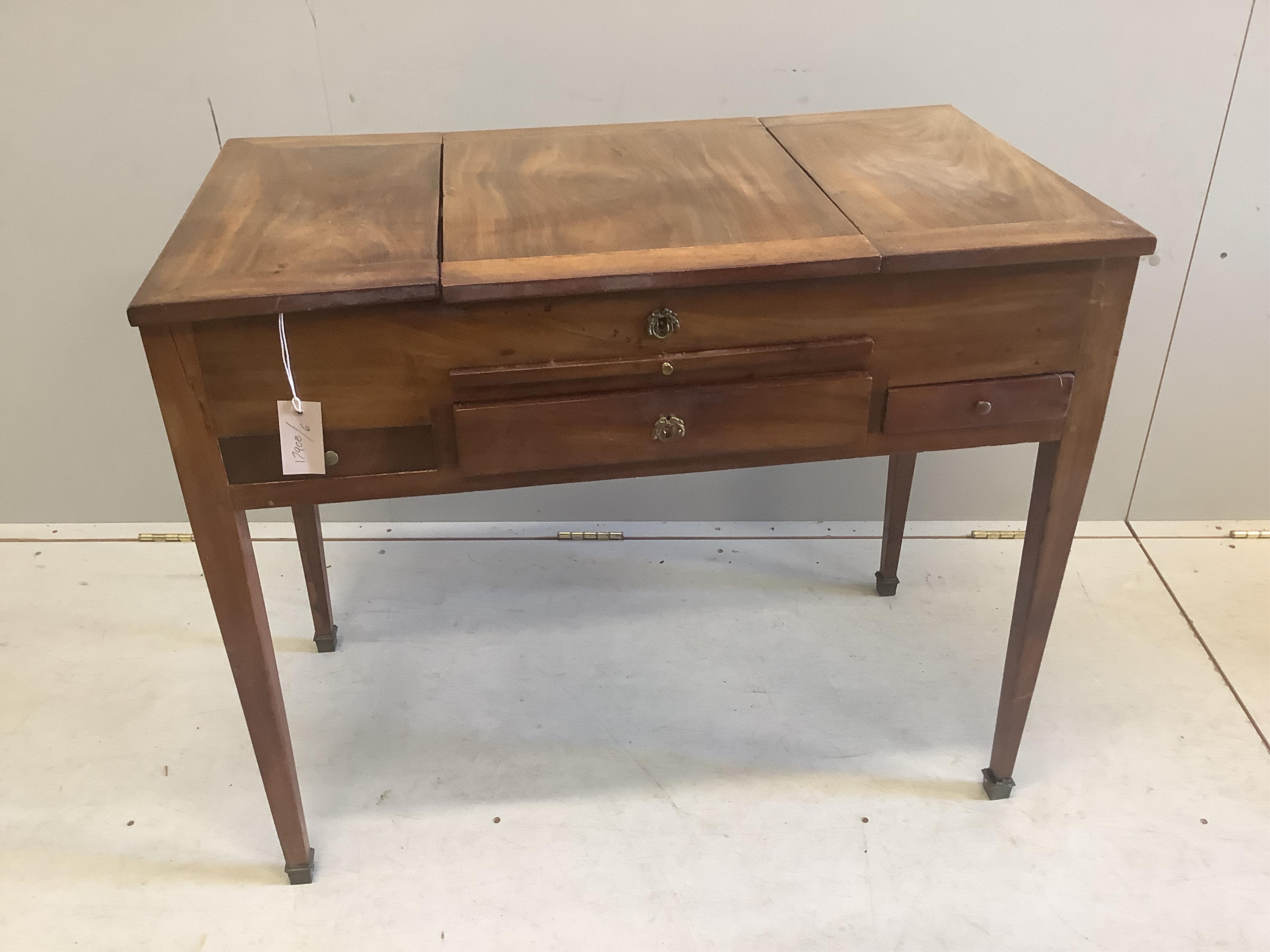 A 19th century Continental mahogany enclosed dressing table, width 86cm, depth 49cm, height 71cm. Condition - fair
